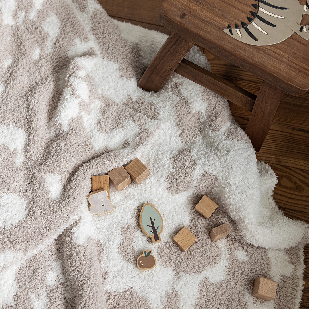 Blushing Beige & White Cow Print Toddler Blanket