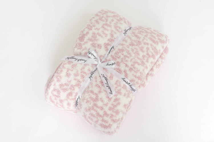 leopard print rose pink and white twin blanket folded