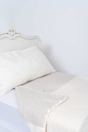 colour block sea salt baby's breath extended throw blanket on bed
