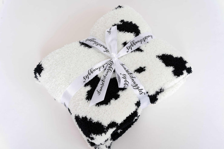 black and white cow print toddler blanket