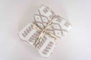 diamond point beige and white toddler blanket folded