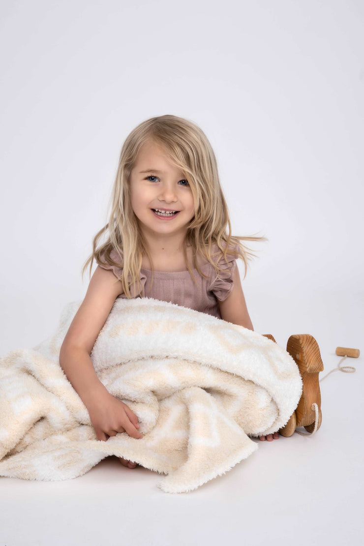 diamond point marshmallow birch toddler blanket with little girl