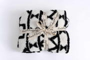 diamond tile black and white toddle blanket folded