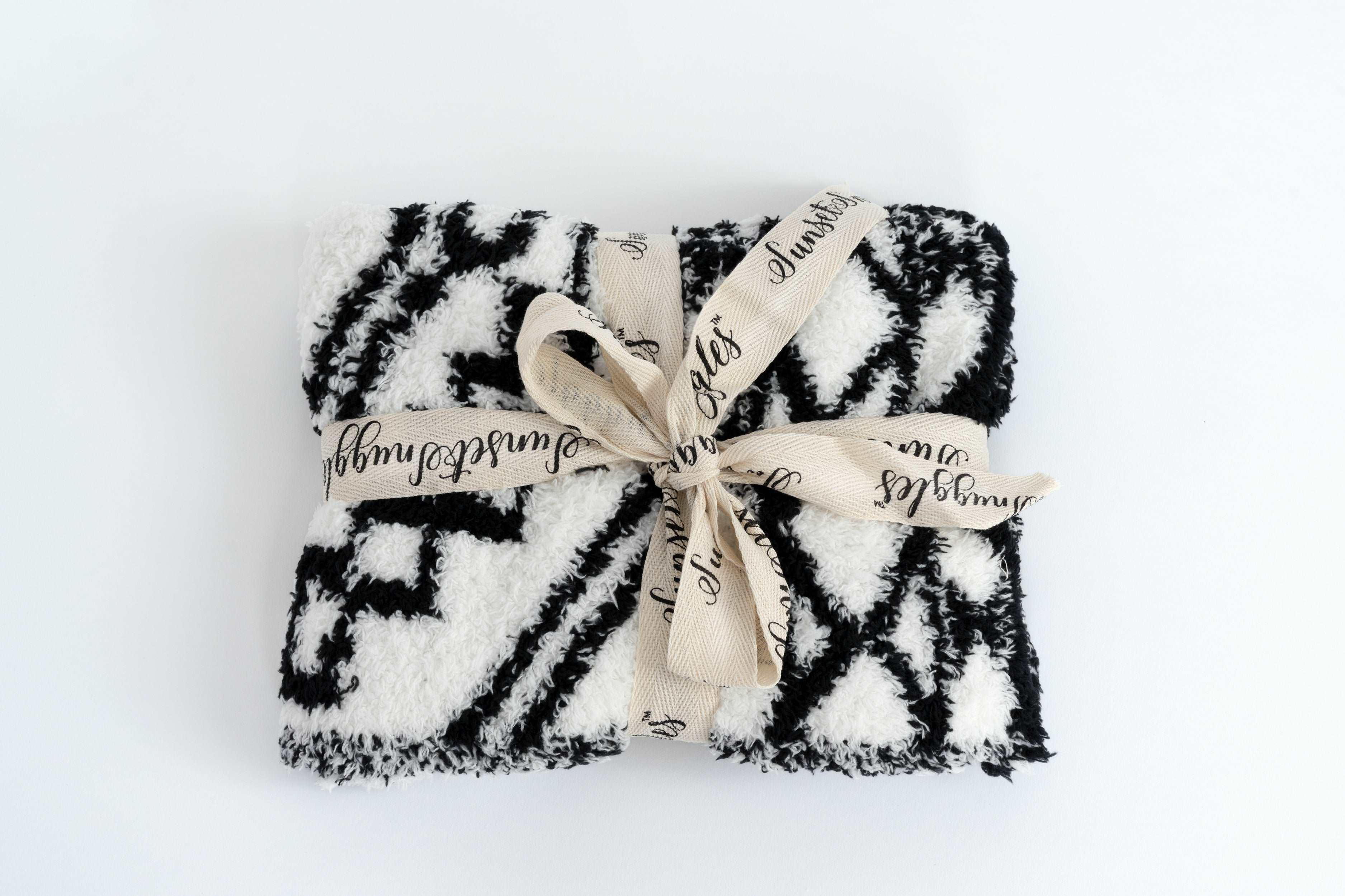 black and white diamond tile lovey baby blanket folded