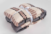 world's softest fluffy throw blanket in pink cream grey and black with geometric stripes
