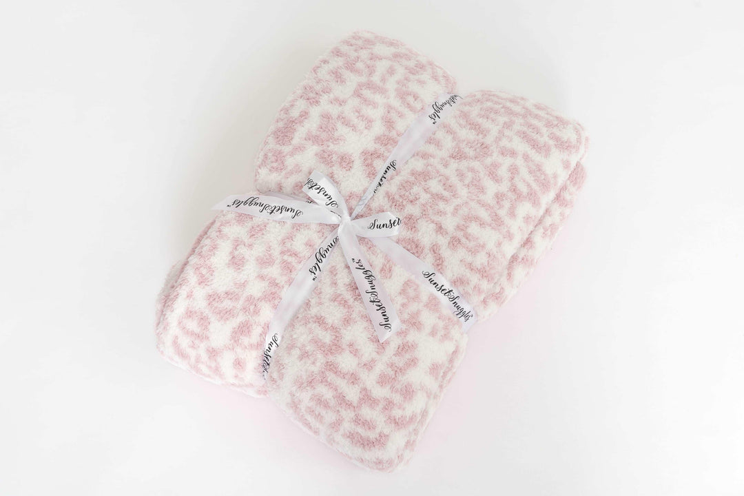 leopard print rose pink and white twin blanket folded