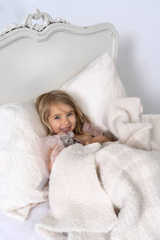 plaid sea salt baby's breath extended throw blanket fitting on a twin bed with little girl and teddy