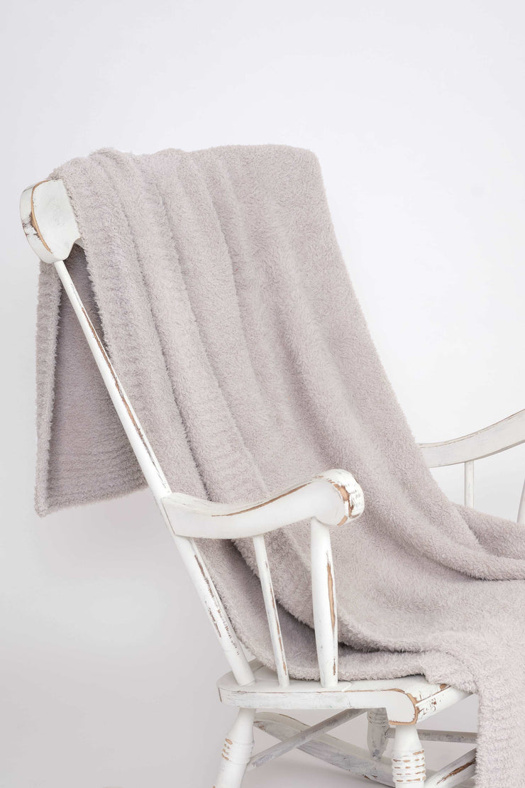 solid rib greige throw on rocking chair