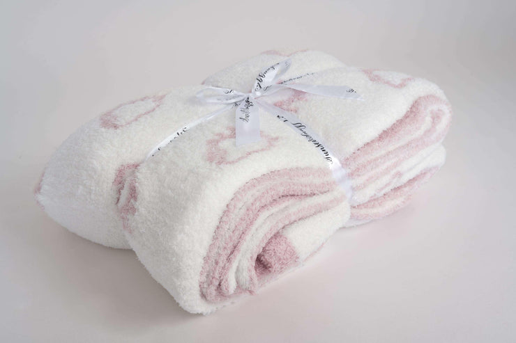 trendy chic luxurious plus soft throw blanket in pink and white with a strawberry pattern